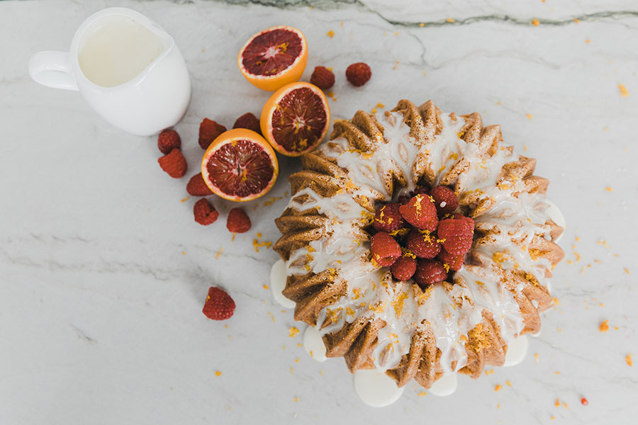 Hand made bunt cake with cream and fresh fruit